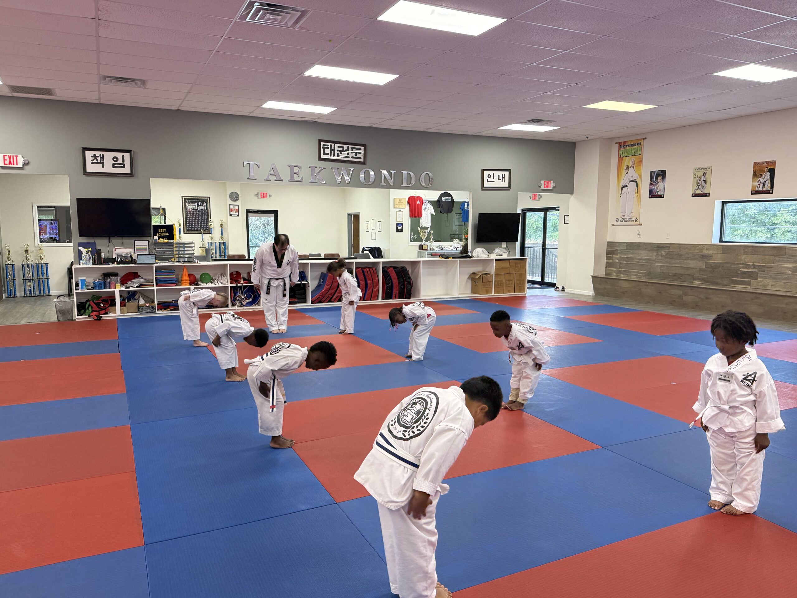 Little Tigers learning Tae Kwon Do with an instructor at Master Shim's World Class Tae Kwon Do