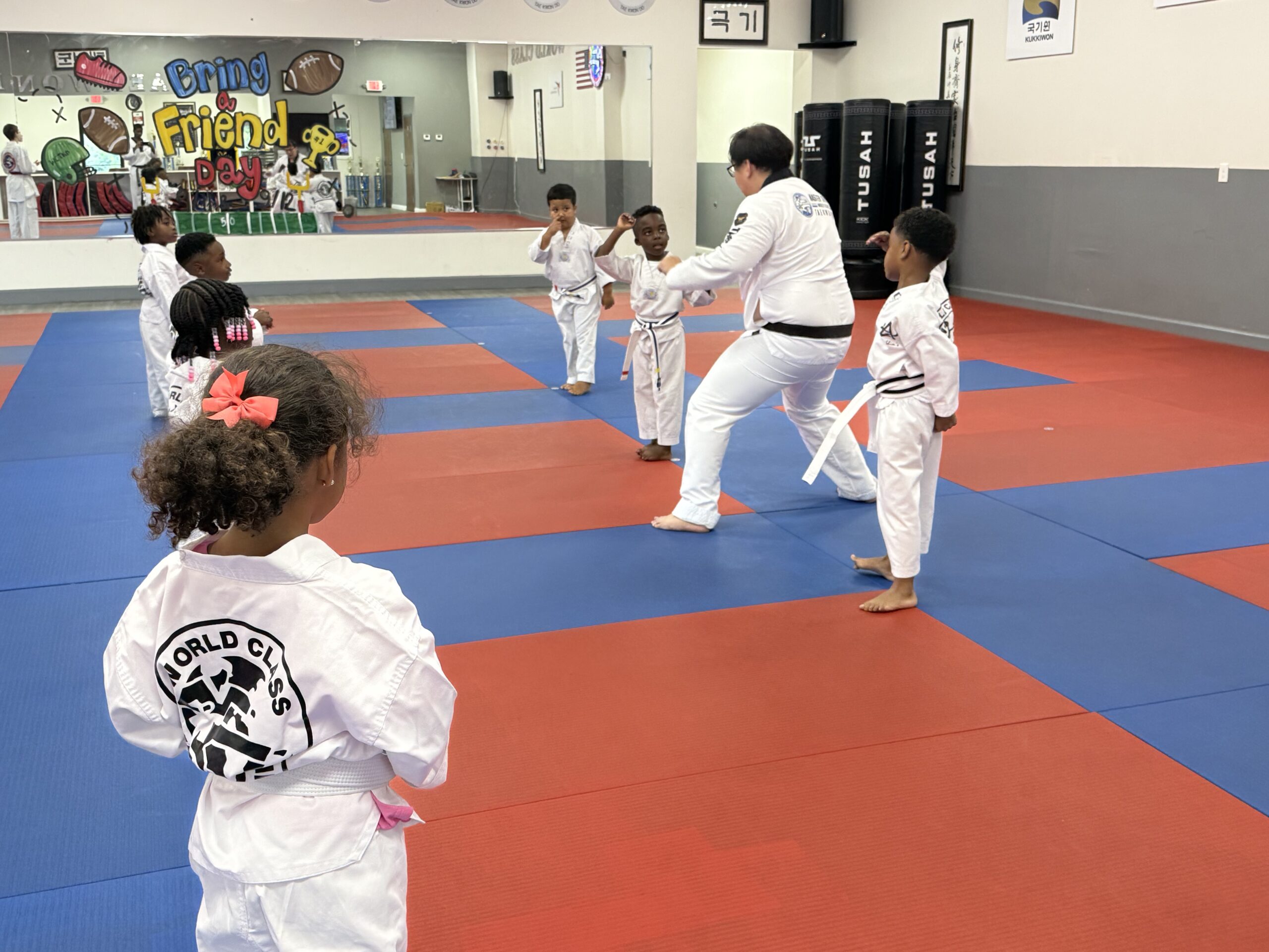 Little Tigers participating in an active preschool Tae Kwon Do class at Master Shim's