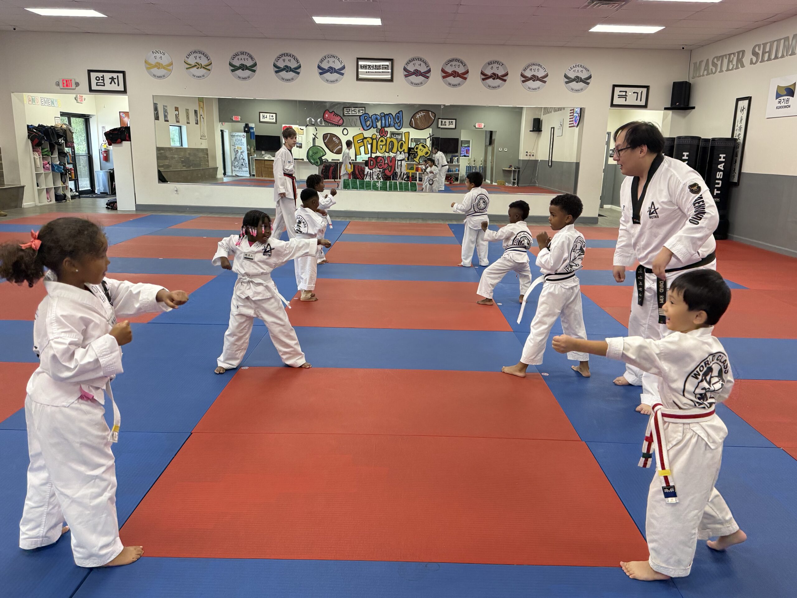 Little Tigers practicing respect and bowing during Tae Kwon Do class at Master Shim's