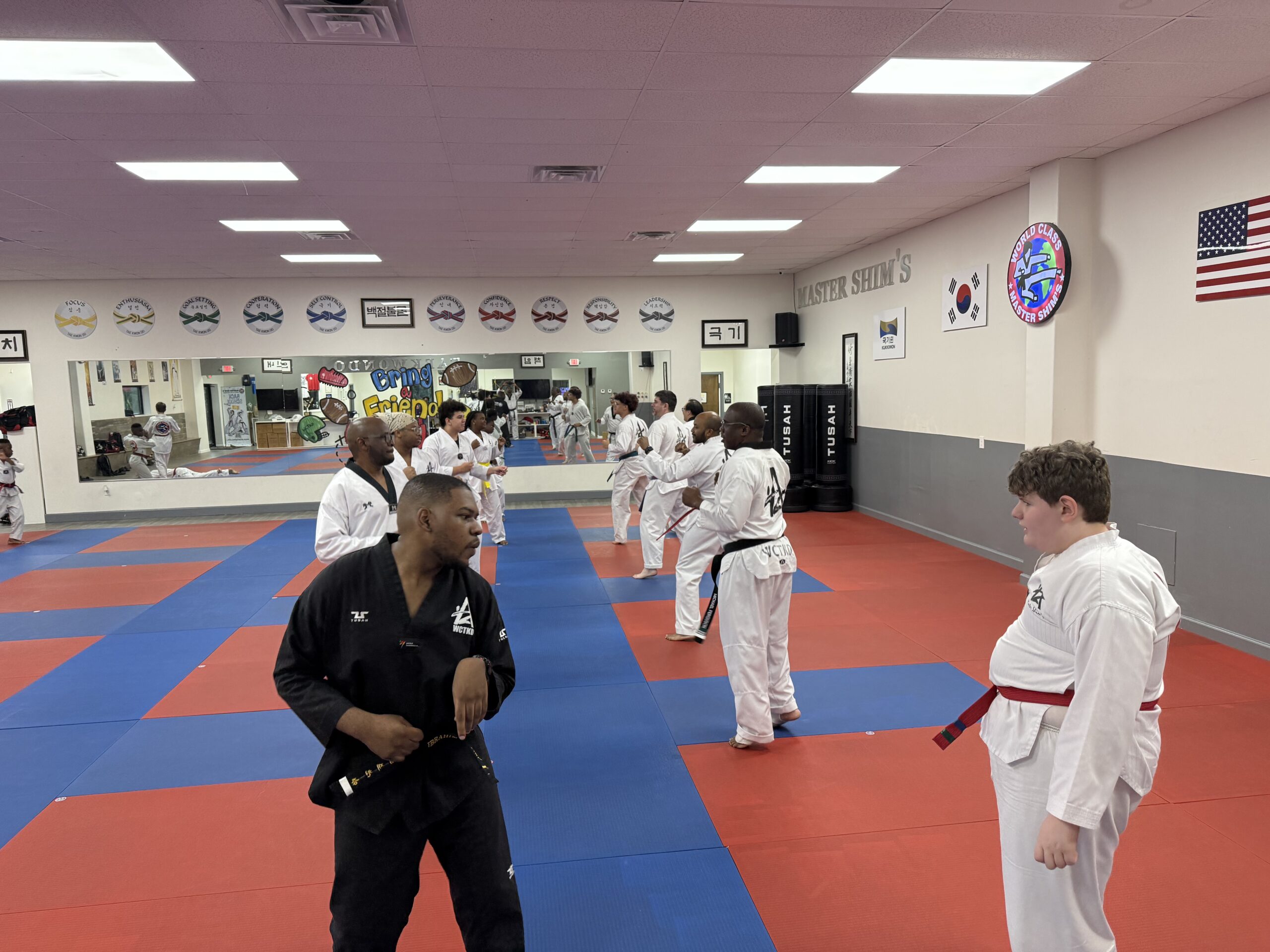 Adult Tae Kwon Do students with different abilities training together at Master Shim's