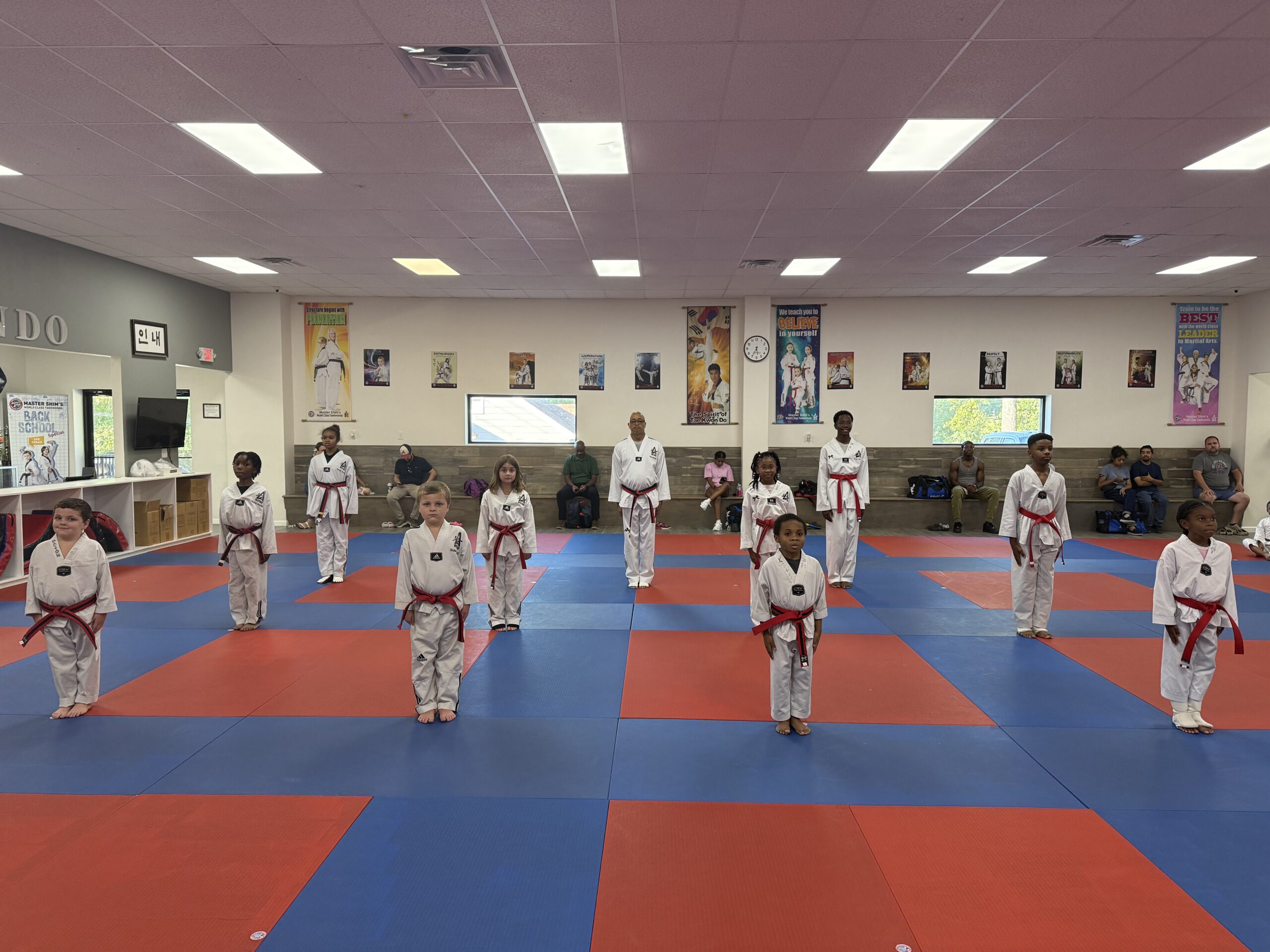 Kids Tae Kwon Do students learning martial arts skills at Master Shim's