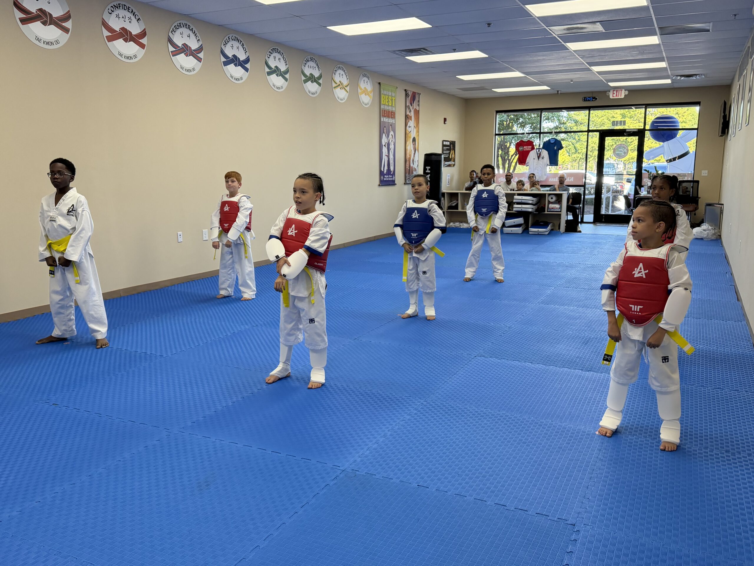 Kids practicing perseverance and martial arts skills during Tae Kwon Do class at Master Shim's