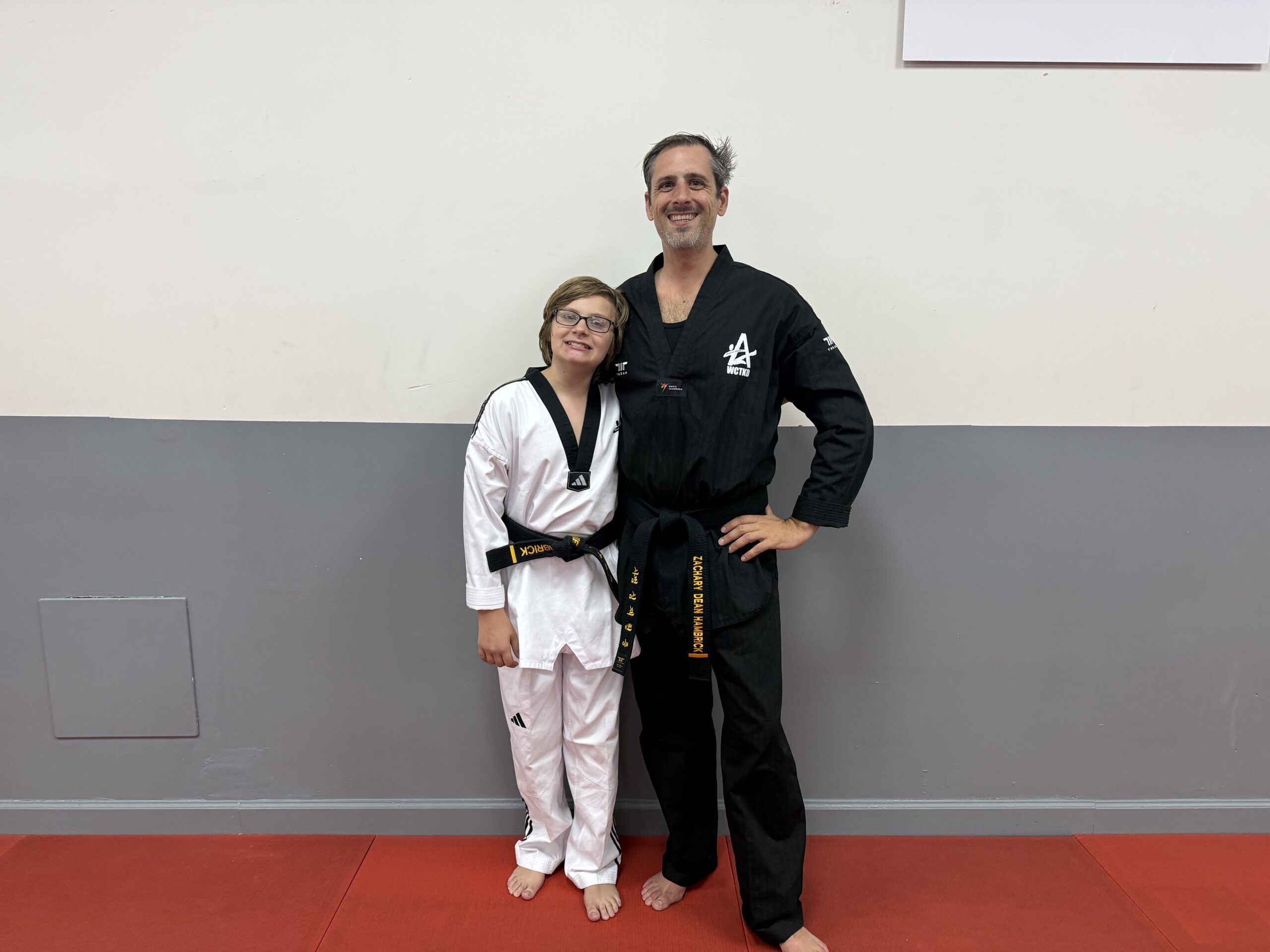 Zachary and Jamie H. sharing their Tae Kwon Do journey at Master Shim's